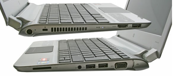 HP Pavilion dm1-3200sa laptop open showing ports and keyboard.