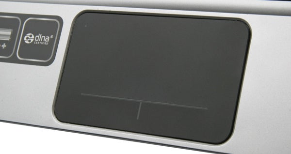 Close-up of HP Pavilion dm1-3200sa touchpad and stickers