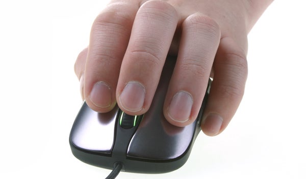 Hand on a SteelSeries Sensei gaming mouse.