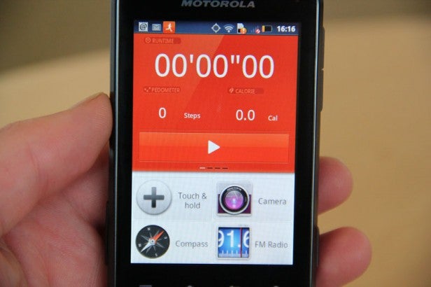 Motorola Defy Mini smartphone displaying fitness apps.Motorola Defy Mini displaying GPS application and compass.