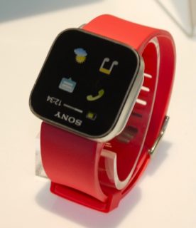 Sony Xperia SmartWatch with red strap on display