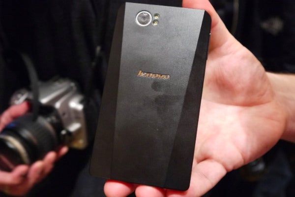 Lenovo K800 smartphone held in hand with camera visible.