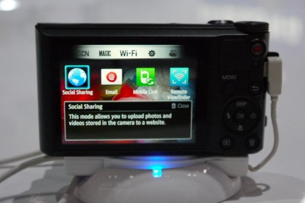 Samsung WB150F camera displaying Wi-Fi connectivity options on screen.
