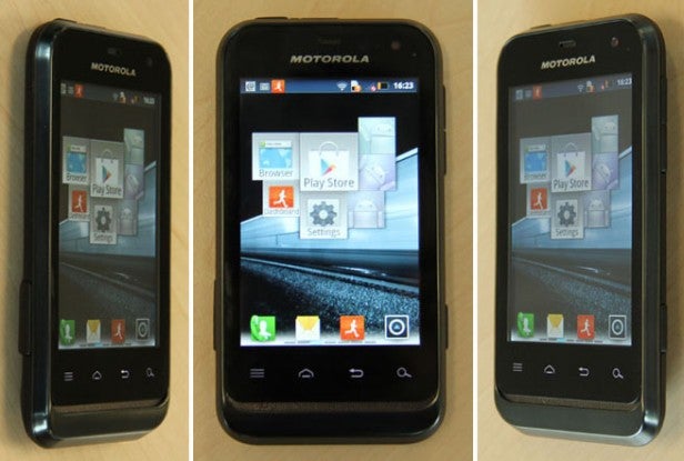 Three Motorola Defy Mini smartphones displaying home screens.