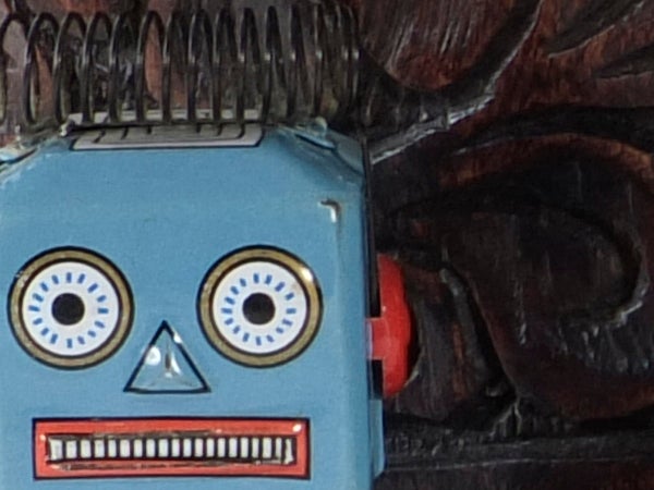 Vintage robot toy close-up photograph.Vintage blue robot toy close-upClose-up of a vintage blue toy robot face.