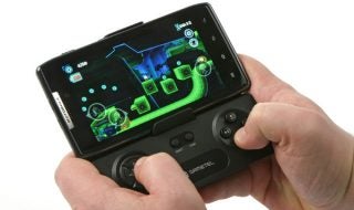 Hands holding a smartphone with a Gametel Bluetooth Controller attached.