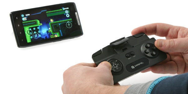 Hands using Gametel Bluetooth Controller with a smartphone.