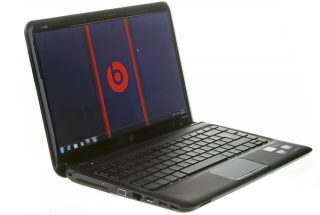 HP Pavilion dm4 Beats Edition laptop with logo on screen.