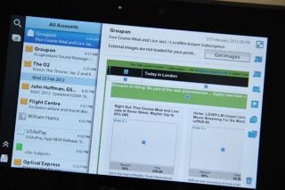 BlackBerry PlayBook displaying emails with 2.0 Firmware update.