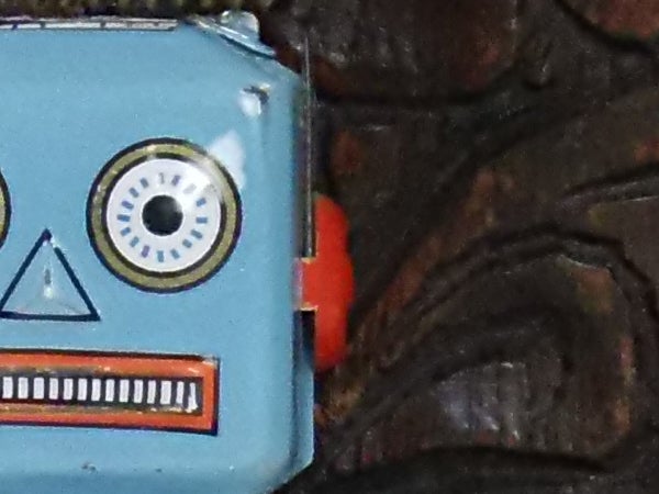 Close-up of a toy robot against a dark background