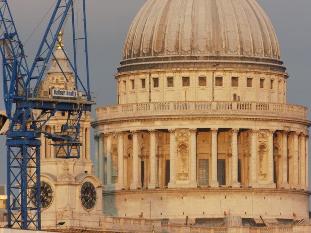 Photo of St. Paul's Cathedral dome with construction crane.