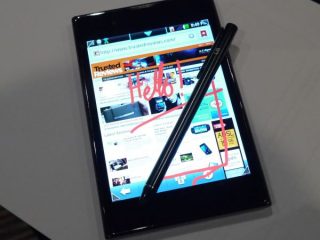 LG Optimus Vu smartphone with stylus on screen displaying website