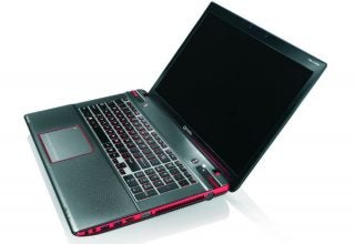 Toshiba Qosmio X870 laptop open on white background.