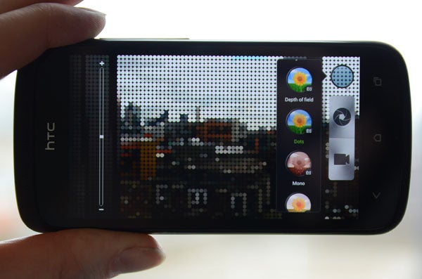 HTC One S smartphone displaying camera interface and effects.