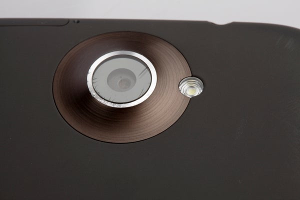 Close-up of HTC One X smartphone camera lens.