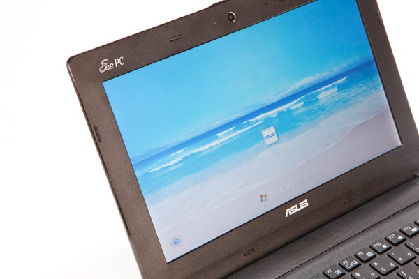 Asus Eee PC X101CH netbook with open screen displaying wallpaper.