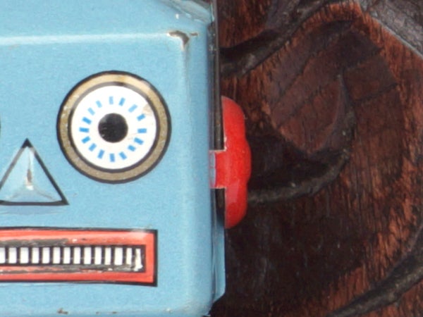 Close-up of a vintage toy robot's face