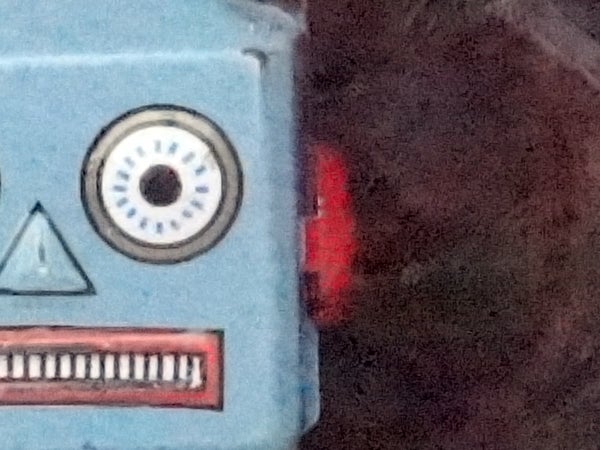 Close-up of a vintage style robot toy's face.