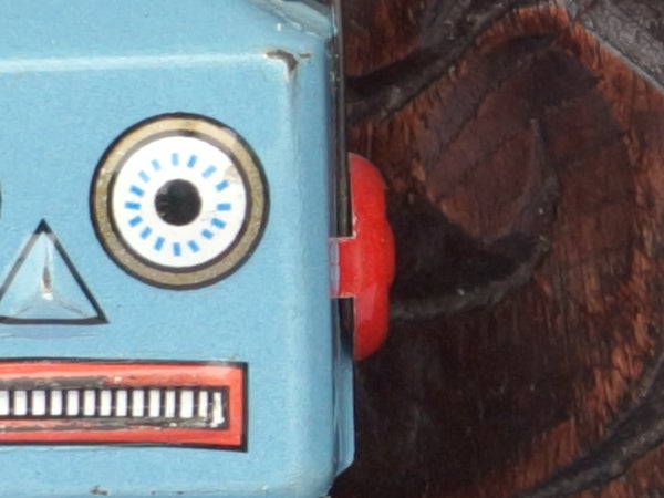 Close-up of a vintage toy robot's face