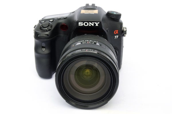 Sony Alpha A77 camera with lens on white background.