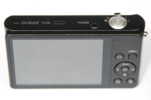 Samsung DV300F digital camera rear view showing LCD screen and buttons.