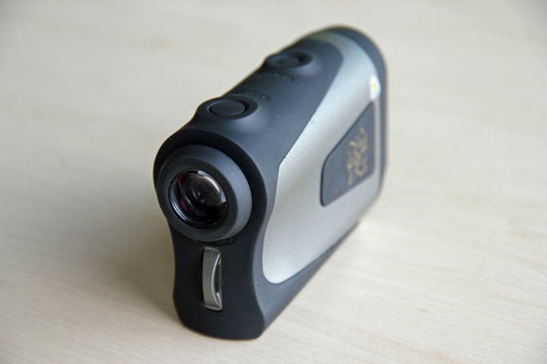 Nikon Laser 1000A S rangefinder on a wooden surface.