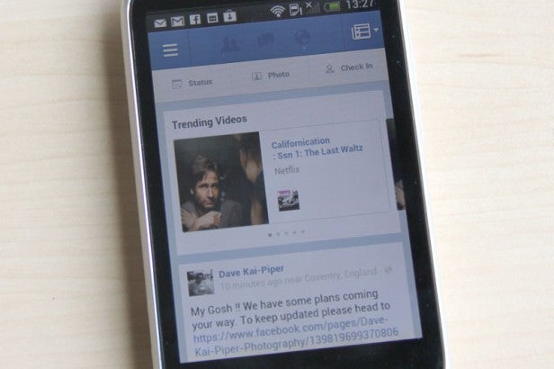 HTC Desire C smartphone displaying Facebook trending videos screen.