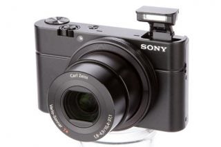 Sony Cyber-shot RX100 camera with pop-up flash extended.