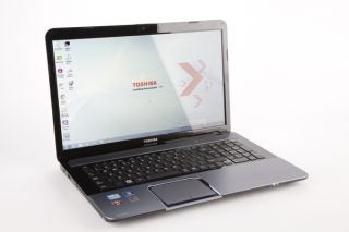 Toshiba Satellite L875-10G laptop open on white background.