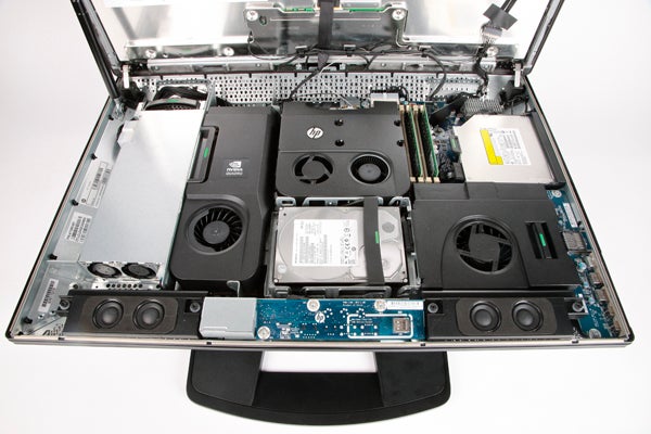 Internal components of an open HP Z1 workstation.HP Z1 workstation opened showing internal components.HP Z1 all-in-one workstation with Windows display on screen.HP Z1 all-in-one workstation at an angled view.