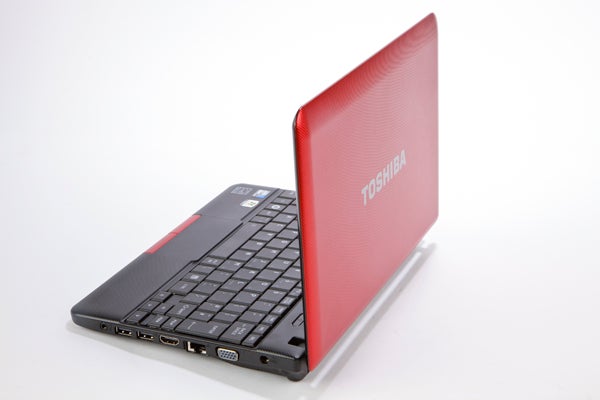 Red Toshiba NB510 netbook on white background.