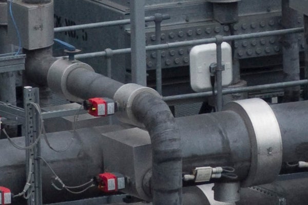 Industrial pipes with sensors and valves in detail.