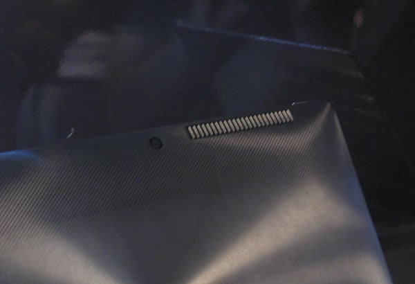 Reflective surface of an Asus Transformer Book laptop.