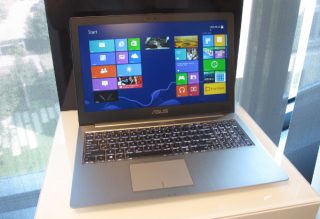 Asus Zenbook U500 laptop with screen on displaying apps.