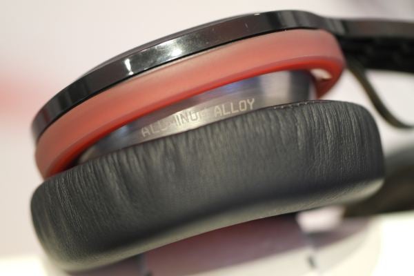 Close-up of Philips headphones cushion and aluminum alloy badge.