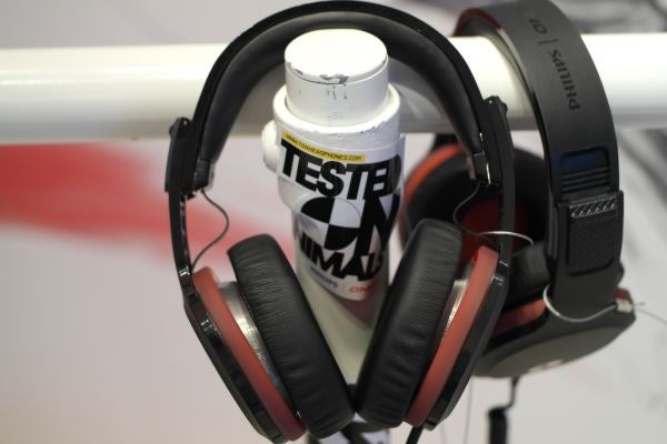 Headphones hanging on a can labeled "TESTED ON ANIMALS - The Crash."