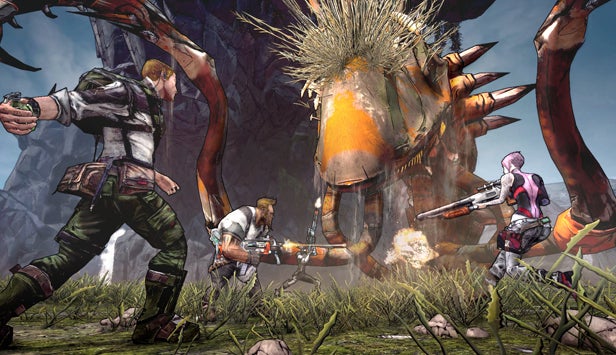 Three characters battling a giant monster in Borderlands 2.