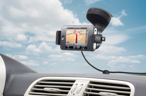 TomTom car kit mounted on vehicle dashboard displaying map.