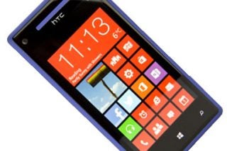 HTC 8X smartphone displaying colorful tiles on screen.
