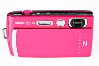 Fujifilm FinePix Z1000EXR pink digital camera on white background.