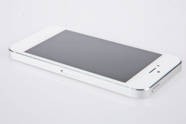 White iPhone 5 on a plain background.