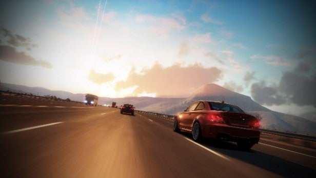 Screenshot from Forza Horizon showing cars racing at sunset.