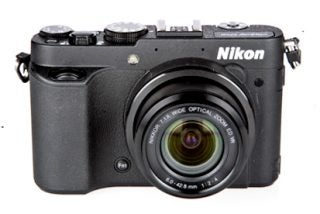 Nikon Coolpix P7700 camera on a white background.