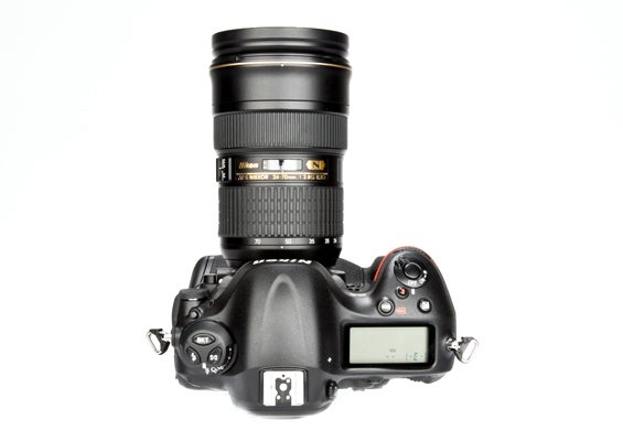 Nikon D4 DSLR camera with lens on white background