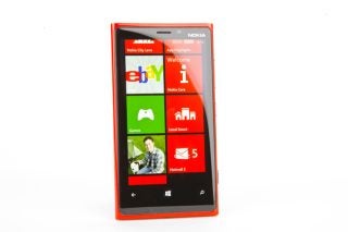 Nokia Lumia 920 smartphone with live tiles on screen.