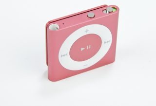 Pink iPod Shuffle 2012 on a white background.
