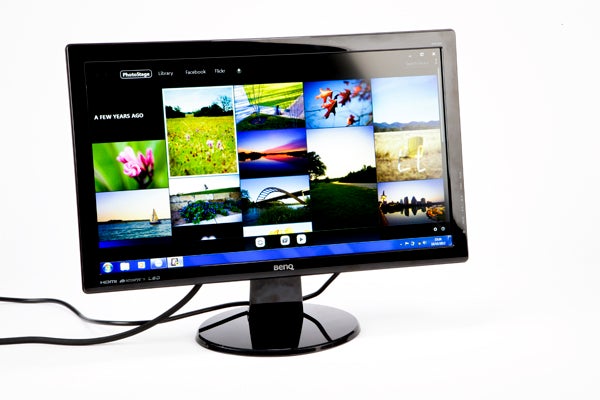 Side view of BenQ GW2250HM monitor on a white background.BenQ GW2250HM monitor displaying colorful photo gallery.