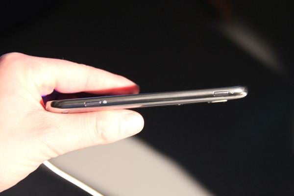 Hand holding Samsung Ativ S smartphone showing its side profile.
