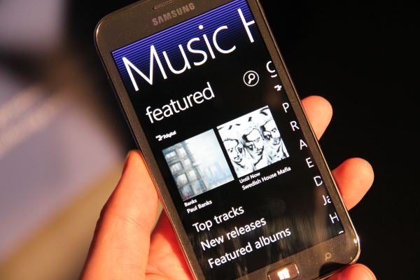 Samsung Ativ S smartphone displaying music app in hand.