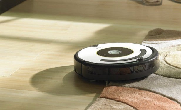 iRobot Roomba 620 vacuum cleaning carpet and hard floor.